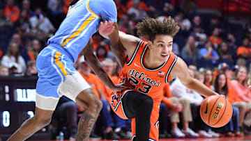 Nov 22, 2025; Champaign, Illinois, USA; Long Island University Sharks guard Malachi Davis (0) guards Illinois Fighting Illini guard Keaton Wagler (23) during the first half at State Farm Center. Mandatory Credit: Ron Johnson-Imagn Images