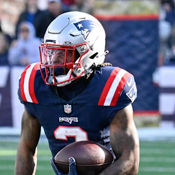 Nov 17, 2024; Foxborough, Massachusetts, USA; New England Patriots wide receiver DeMario Douglas (3) runs the ball against the Los Angeles Rams during the first half at Gillette Stadium. Mandatory Credit: Eric Canha-Imagn Images