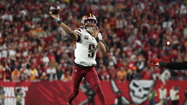 Washington Commanders quarterback Jayden Daniels (5) throws during the second quarter of a NFC wild card playoff against the Tampa Bay Buccaneers at Raymond James Stadium. Washington Commanders quarterback Jayden Daniels (5) throws during the second quarter of a NFC wild card playoff against the Tampa Bay Buccaneers at Raymond James Stadium.