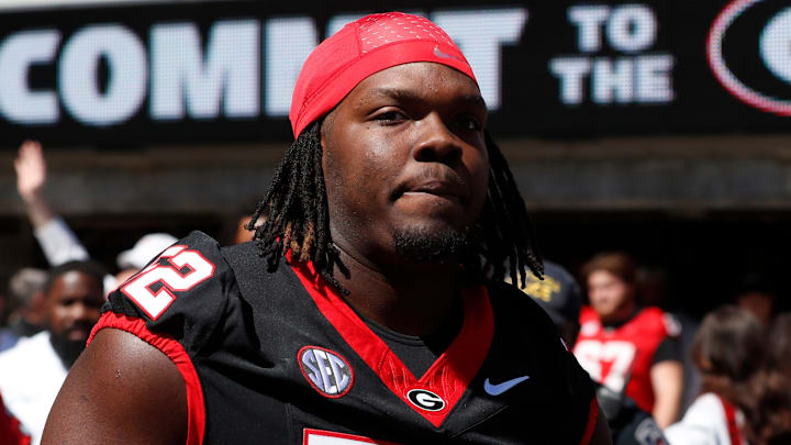 Georgia defensive lineman Christen Miller (52) arrives with the team before the start of the G-Day spring football game in Athens, Ga., on Saturday, April 13, 2024.
