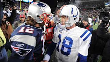 Indianapolis Colts quarterback Peyton Manning, right, meets with New England Patriots quarterback Tom Brady after a game at Gillette Stadium on Nov. 21, 2010. The Colts lost 31-28.