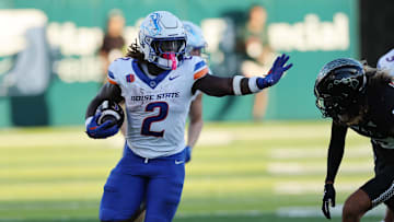 Oct 12, 2024; Honolulu, Hawaii, USA;  Boise State Broncos running back Ashton Jeanty (2) stiff arms Hawaii Rainbow Warriors defensive back Kilinahe Mendiola-Jensen (29) for a touchdown during the first quarter an NCAA college football game at Clarence T.C. Ching Athletics Complex. Mandatory Credit: Marco Garcia-Imagn Images