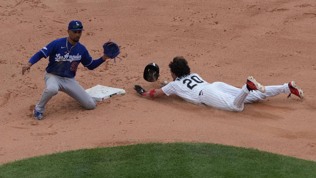 Jun 14, 2026; Chicago, Illinois, USA; Chicago White Sox third baseman Miguel Vargas (20) steals second base as Los Angeles Dodgers shortstop Mookie Betts (50) takes the throw during the sixth inning at Rate Field. Mandatory Credit: David Banks-Imagn Images