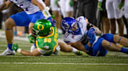 Boise State linebacker Marco Notarainni gains control of a fumble.