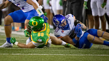 Boise State linebacker Marco Notarainni gains control of a fumble.