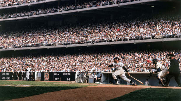 Willie Mays in action, at bat vs Los Angeles Dodgers. View of Dodger Stadium in 1962. 