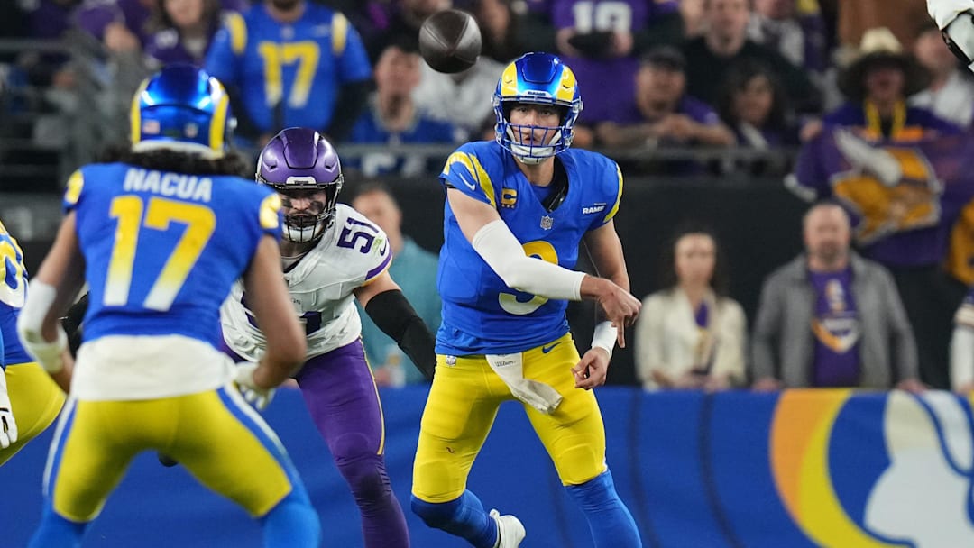 Los Angeles Rams quarterback Matthew Stafford (9) throws the ball to receiver Puka Nacua (17) against the Minnesota Vikings during their playoff game at State Farm Stadium on Jan. 13, 2025, in Glendale.