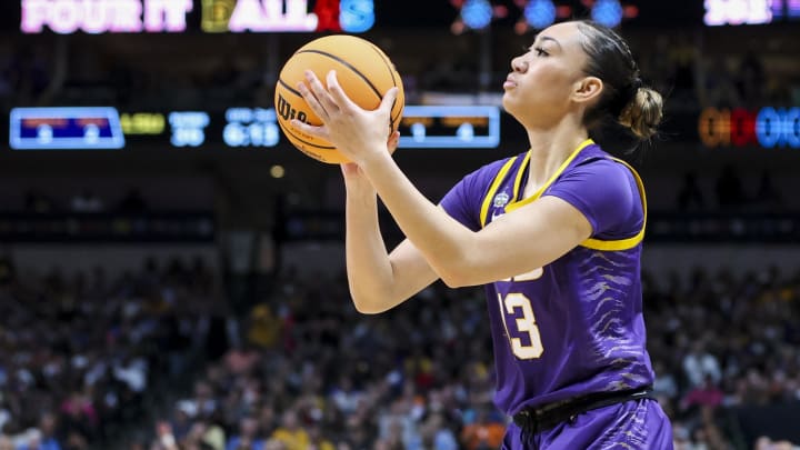 Apr 2, 2023; Dallas, TX, USA; LSU Lady Tigers guard Last-Tear Poa (13) attempts a three-point basket against the Iowa Hawkeyes in the first half during the final round of the Women's Final Four NCAA tournament at the American Airlines Center. 