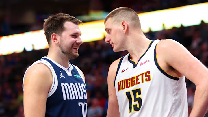 Mar 17, 2024; Dallas, Texas, USA;  Dallas Mavericks guard Luka Doncic (77) speaks with Denver Nuggets center Nikola Jokic (15) during the second half at American Airlines Center. 