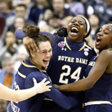 Former Notre Dame stars Marina Mabrey, Arike Ogunbowale and Jackie Young celebrate winning in the Final Four in 2018.