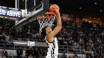 Jan 27, 2024; Providence, Rhode Island, USA; Providence Friars guard Devin Carter (22)  makes a reverse dunk during the first half against the Georgetown Hoyas at Amica Mutual Pavilion. Mandatory Credit: Eric Canha-USA TODAY Sports