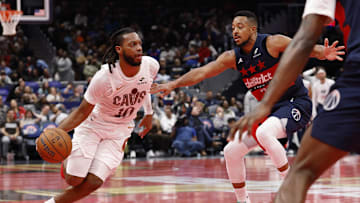 Nov 7, 2025; Washington, District of Columbia, USA; Cleveland Cavaliers guard Darius Garland (10) drives to the basket as Washington Wizards guard CJ McCollum (3) defends in the second half in an Emirates NBA Cup game at Capital One Arena. Mandatory Credit: Geoff Burke-Imagn Images