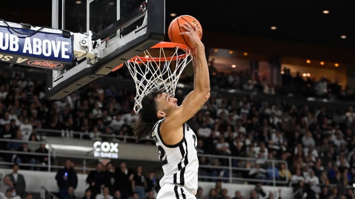 Jan 27, 2024; Providence, Rhode Island, USA; Providence Friars guard Devin Carter (22)  makes a reverse dunk during the first half against the Georgetown Hoyas at Amica Mutual Pavilion. Mandatory Credit: Eric Canha-USA TODAY Sports