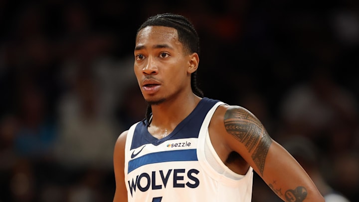 Nov 21, 2025; Phoenix, Arizona, USA; Minnesota Timberwolves guard Rob Dillingham (4) against the Phoenix Suns during an NBA Cup game at Mortgage Matchup Center. Mandatory Credit: Mark J. Rebilas-Imagn Images