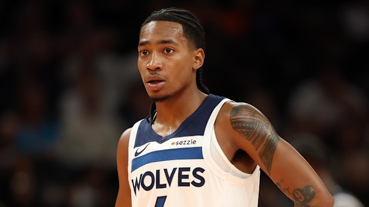 Nov 21, 2025; Phoenix, Arizona, USA; Minnesota Timberwolves guard Rob Dillingham (4) against the Phoenix Suns during an NBA Cup game at Mortgage Matchup Center. Mandatory Credit: Mark J. Rebilas-Imagn Images