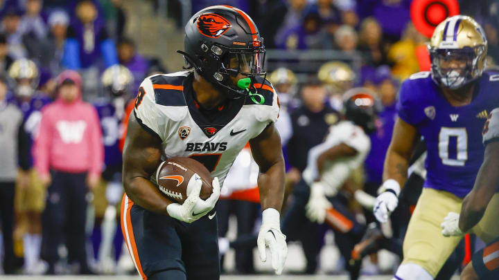 Nov 4, 2022; Seattle, Washington, USA; Oregon State Beavers running back Jam Griffin (8) rushes against the Washington Huskies during the second quarter at Alaska Airlines Field at Husky Stadium. Mandatory Credit: Joe Nicholson-USA TODAY Sports