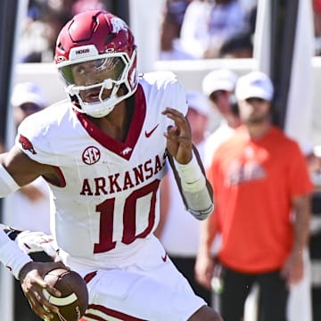 Arkansas Razorbacks quarterback Taylen Green (10) runs the ball while defended by Mississippi State Bulldogs defensive lineman Deonte Anderson (91) during the second quarter at Davis Wade Stadium at Scott Field during 2024 season.