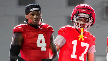 Ohio State Buckeyes wide receivers Jeremiah Smith (4), Carnell Tate (17) and Brandon Inniss (1) watch during spring football practice at the Woody Hayes Athletic Center on March 17, 2025.