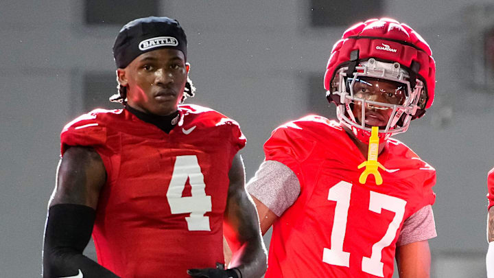 Ohio State Buckeyes wide receivers Jeremiah Smith (4), Carnell Tate (17) and Brandon Inniss (1) watch during spring football practice at the Woody Hayes Athletic Center on March 17, 2025.