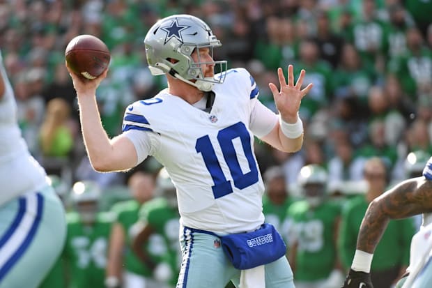 Dallas Cowboys quarterback Cooper Rush (10) throws a touchdown pass against the Philadelphia Eagles