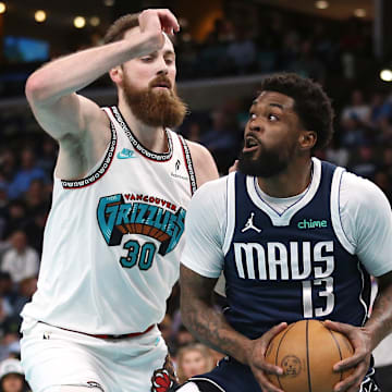 Jay Huff defends the Mavericks' Najj Marshall in an April game.