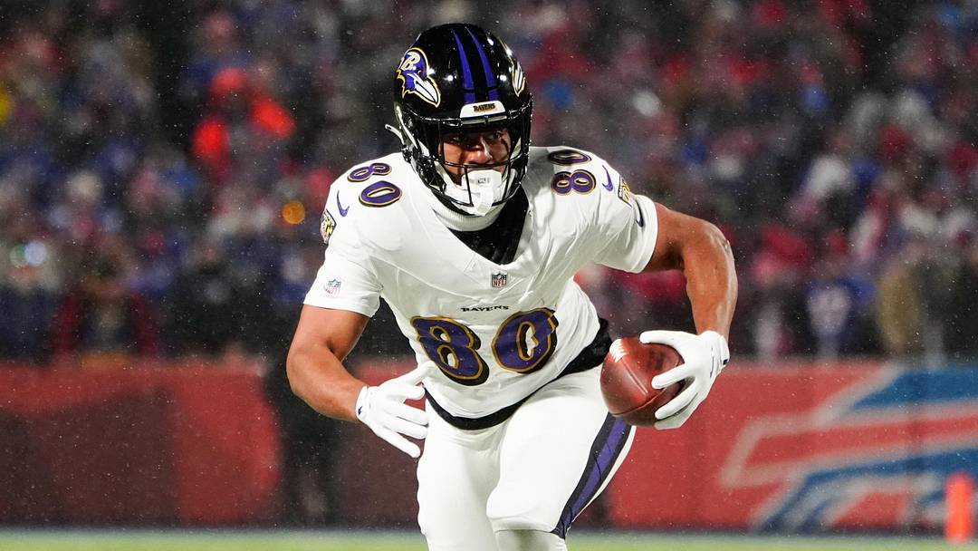 Jan 19, 2025; Orchard Park, New York, USA; Baltimore Ravens tight end Isaiah Likely (80) runs the ball after making a catch during the first quarter against the Buffalo Bills in a 2025 AFC divisional round game at Highmark Stadium. Mandatory Credit: Gregory Fisher-Imagn Images