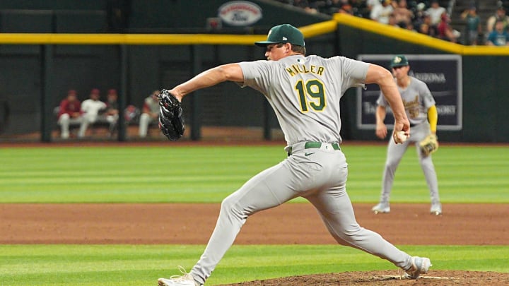 Jun 28, 2024; Phoenix, Arizona, USA; Oakland Athletics pitcher Mason Miller (19) throws in the ninth inning against Arizona Diamondbacks at Chase Field. Mandatory Credit: Allan Henry-USA TODAY Sports