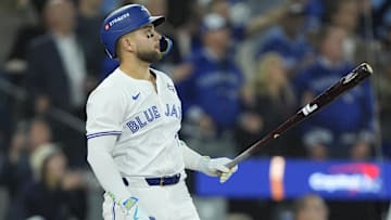 Nov 1, 2025; Toronto, Ontario, CAN; Toronto Blue Jays designated hitter Bo Bichette (11) hits a three run home run against the Los Angeles Dodgers in the third inning during game seven of the 2025 MLB World Series at Rogers Centre.