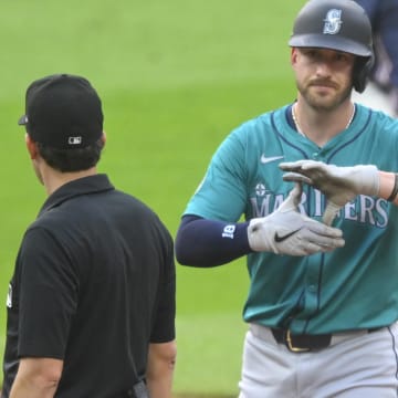 Seattle Mariners designated hitter Mitch Garver (18) celebrates his RBI double in the third inning against the Cleveland Guardians at Progressive Field on June 18.