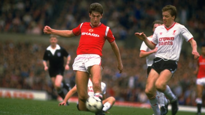 Norman Whiteside of manchester United and Steve Nicholl of Liverpool