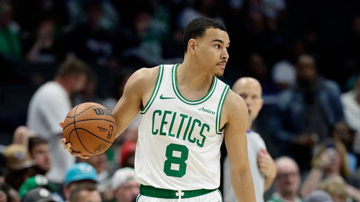 Mar 29, 2026; Charlotte, North Carolina, USA; Boston Celtics guard John Tonje (8) controls the ball as time runs down in the second half against the Charlotte Hornets at Spectrum Center. Mandatory Credit: Brian Westerholt-Imagn Images