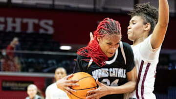 Mar 8, 2024; Piscataway, NJ, USA; Morris Catholic vs. Rutgers Prep in the NJSIAA Non-Public B Girls Basketball Final at Rutgers Athletic Center. MC #24 Tatianna Collins drives to the basket as RP #24 Gigi Battle defends.