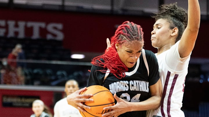 Mar 8, 2024; Piscataway, NJ, USA; Morris Catholic vs. Rutgers Prep in the NJSIAA Non-Public B Girls Basketball Final at Rutgers Athletic Center. MC #24 Tatianna Collins drives to the basket as RP #24 Gigi Battle defends.