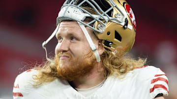 Jan 5, 2025; Glendale, Arizona, USA; San Francisco 49ers offensive tackle Austen Pleasants (62) against the Arizona Cardinals at State Farm Stadium. Mandatory Credit: Mark J. Rebilas-Imagn Images