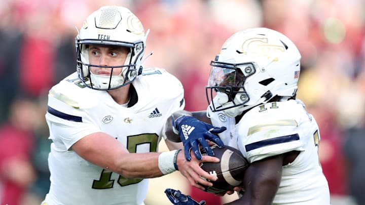 Aug 24, 2024; Dublin, IRL; Georgia Tech quarterback Haynes King hands the ball off to Jamal Haynes at Aviva Stadium. Mandatory Credit: Tom Maher/INPHO via Imagn Images