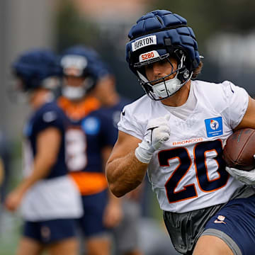 Jul 26, 2024; Englewood, CO, USA; Denver Broncos fullback Michael Burton (20) during training camp at Broncos Park Powered by CommonSpirit. 