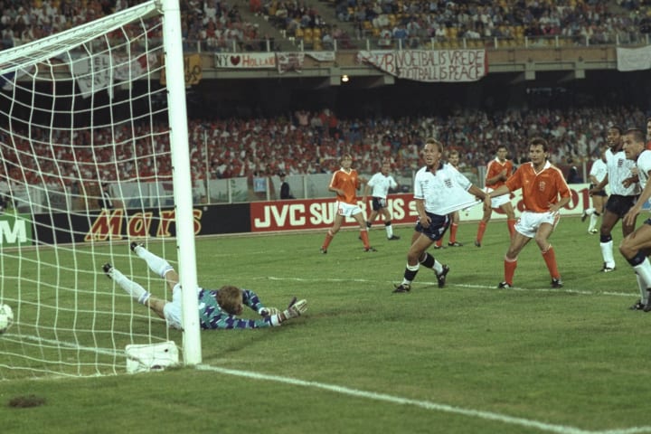 David Platt John Barnes and Steve Bull all of England watch as Stuart Pearce of England