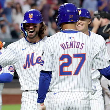 Sep 4, 2024; New York City, New York, USA; New York Mets designated hitter Jesse Winker (3) celebrates his grand slam home run against the Boston Red Sox with right fielder Tyrone Taylor (15) and shortstop Francisco Lindor (12) and third baseman Mark Vientos (27) and left fielder Brandon Nimmo (9) during the first inning at Citi Field. Mandatory Credit: Brad Penner-Imagn Images