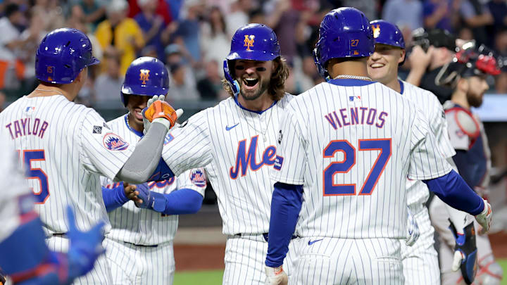 Sep 4, 2024; New York City, New York, USA; New York Mets designated hitter Jesse Winker (3) celebrates his grand slam home run against the Boston Red Sox with right fielder Tyrone Taylor (15) and shortstop Francisco Lindor (12) and third baseman Mark Vientos (27) and left fielder Brandon Nimmo (9) during the first inning at Citi Field. Mandatory Credit: Brad Penner-Imagn Images