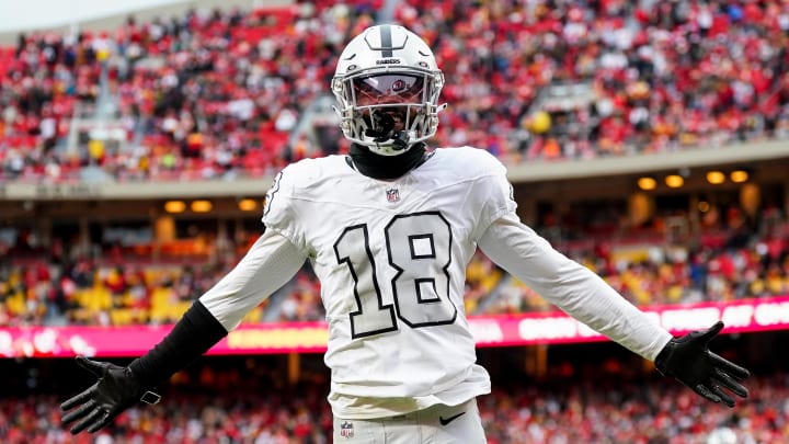 Dec 25, 2023; Kansas City, Missouri, USA; Las Vegas Raiders cornerback Jack Jones (18) interacts with the crowd after a play during the second half against the Kansas City Chiefs at GEHA Field at Arrowhead Stadium. Mandatory Credit: Jay Biggerstaff-USA TODAY Sports