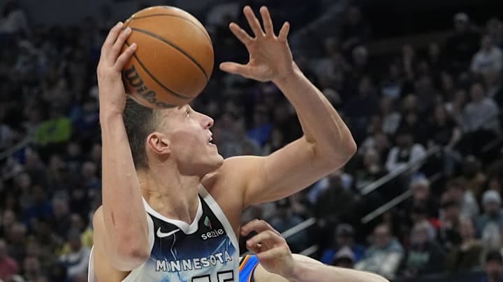 Feb 13, 2025; Minneapolis, Minnesota, USA; Minnesota Timberwolves forward Luka Garza (55) goes to the basket against the Oklahoma City Thunder in the fourth quarter at Target Center. Mandatory Credit: Bruce Kluckhohn-Imagn Images