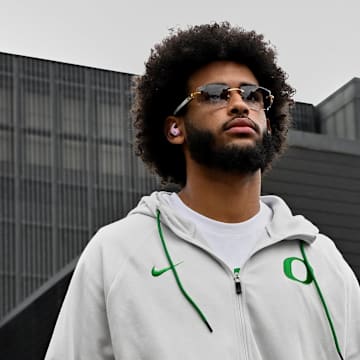 Oct 11, 2025; Eugene, Oregon, USA; Oregon Ducks quarterback Dante Moore (5) arrives with his teammates before the game against the Indiana Hoosiers at Autzen Stadium. Mandatory Credit: Troy Wayrynen-Imagn Images