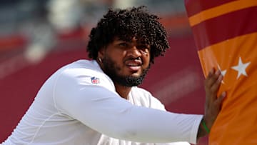 Tampa Bay Buccaneers offensive tackle Tristan Wirfs warms up before a game against the Atlanta Falcons.