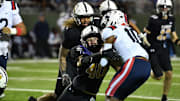 Amarillo's Troy Brown (40) takes down Richland's Jayshon Gibson (10) during an Area playoff game on Saturday, November 23, 2024 at Memorial Stadium.