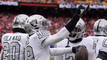 Dec 25, 2023; Kansas City, Missouri, USA; Las Vegas Raiders cornerback Jack Jones (18) celebrates against the Kansas City Chiefs after scoring on a pick six interception during the game at GEHA Field at Arrowhead Stadium. The touchdown was called back due to a penalty. Mandatory Credit: Denny Medley-USA TODAY Sports