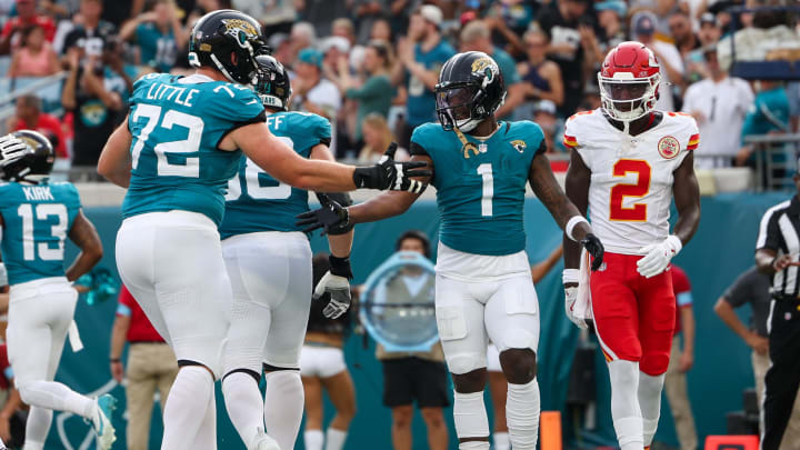 Aug 10, 2024; Jacksonville, Florida, USA; Jacksonville Jaguars running back Travis Etienne Jr. (1) celebrates with offensive tackle Walker Little (72) after scoring a touchdown against the Kansas City Chiefs in the first quarter during preseason at EverBank Stadium. Mandatory Credit: Nathan Ray Seebeck-USA TODAY Sports