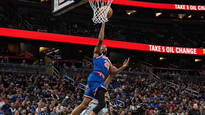 Dec 15, 2024; Orlando, Florida, USA; New York Knicks guard Mikal Bridges (25) lays the ball in over Orlando Magic guard Anthony Black (0) in the first quarter at Kia Center. Mandatory Credit: Jeremy Reper-Imagn Images Dec 15, 2024; Orlando, Florida, USA; New York Knicks guard Mikal Bridges (25) lays the ball in over Orlando Magic guard Anthony Black (0) in the first quarter at Kia Center. Mandatory Credit: Jeremy Reper-Imagn Images