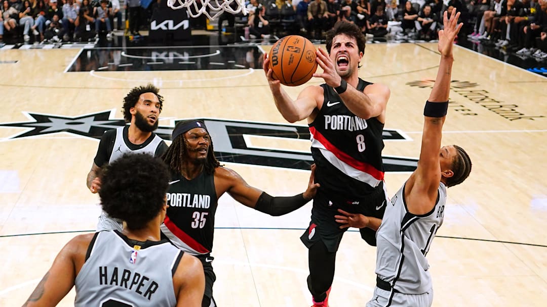 Apr 8, 2026; San Antonio, Texas, USA; Portland Trail Blazers forward Deni Avdija (8) drives to the basket against San Antonio Spurs forward Carter Bryant (11) during the first half at Frost Bank Center.