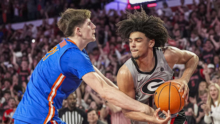 Feb 25, 2025; Athens, Georgia, USA; Georgia Bulldogs forward Asa Newell (14) gets fouled by Florida Gators forward Alex Condon (21) late in the game during the second half at Stegeman Coliseum. Mandatory Credit: Dale Zanine-Imagn Images