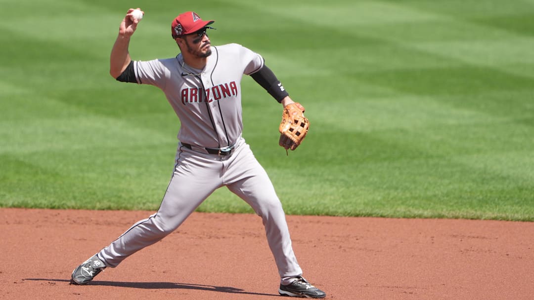 Apr 15, 2026; Baltimore, Maryland, USA; Arizona Diamondbacks third baseman Nolan Arenado throws out Baltimore Orioles designated hitter Taylor Ward (not pictured) after fielding a ground ball during the first inning at Oriole Park at Camden Yards. Mandatory Credit: Gregory Fisher-Imagn Images